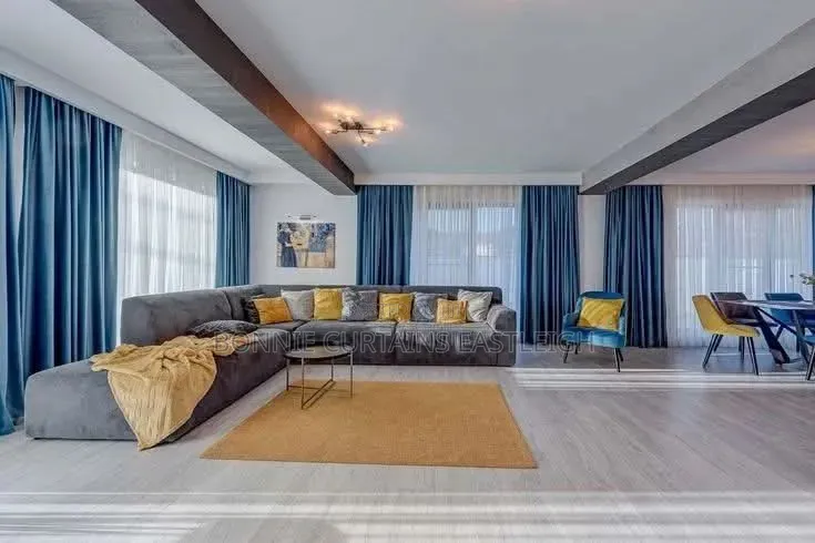 Blue Curtains and Gold Sheers With Rings