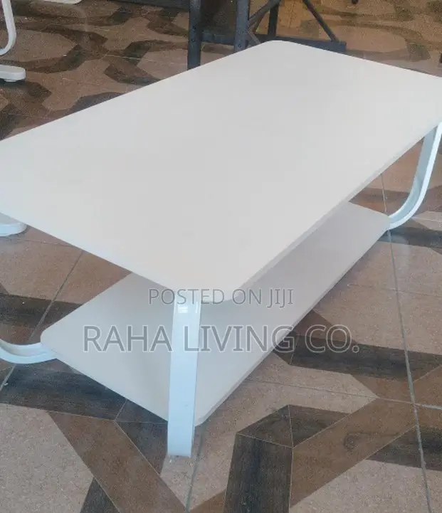 Modern White Coffee Table With Curved Legs and Lower Shelf