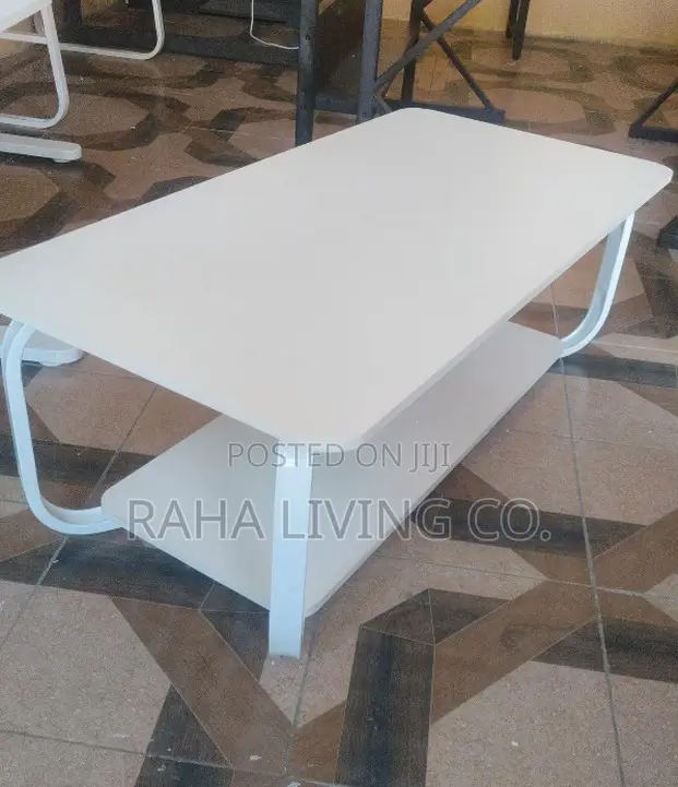 Modern White Coffee Table With Curved Legs and Lower Shelf