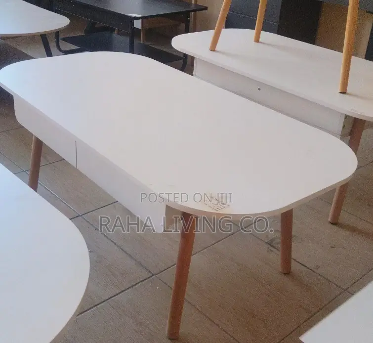 Modern White Oval Coffee Table With Drawers and Wooden Legs