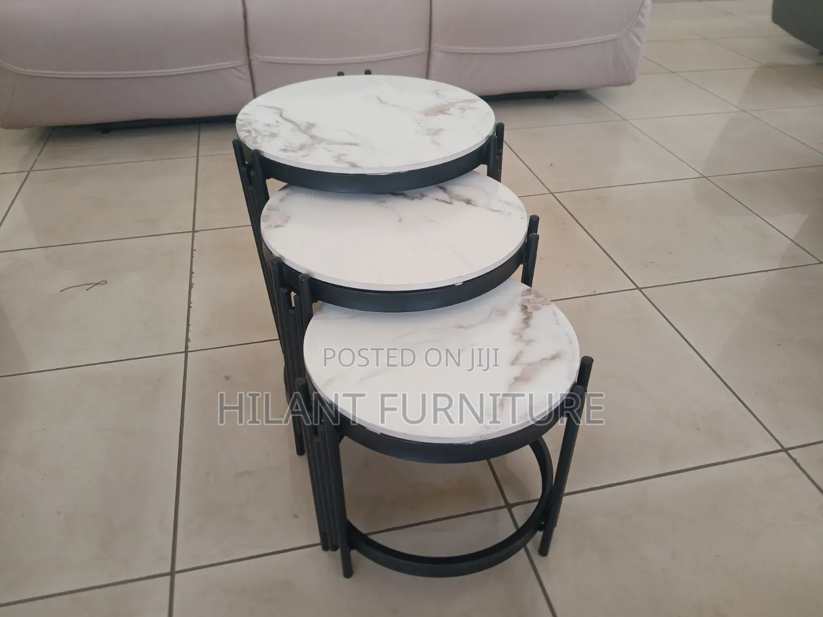 3 in 1 Round Marble Nesting Stools With Black Metallic Stands.