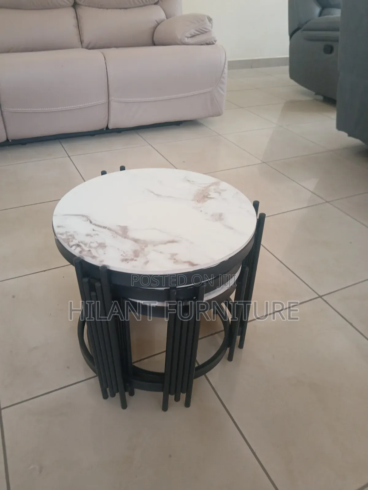 3 in 1 Round Marble Nesting Stools With Black Metallic Stands.