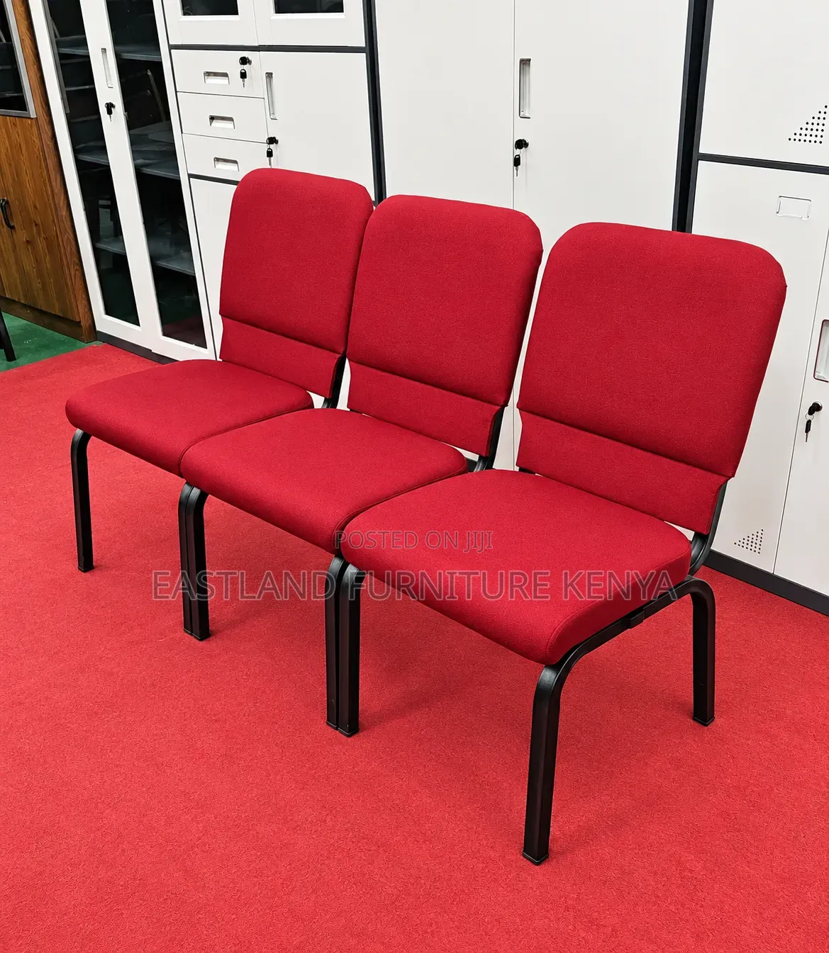 Red Waiting Bench With Padded Seats and Black Metal Frame