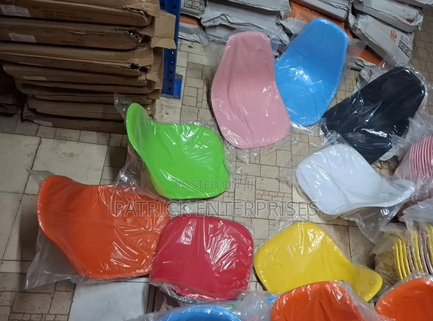 The Image Shows a Pink Eames-Style Modern Plastic Dining Chair