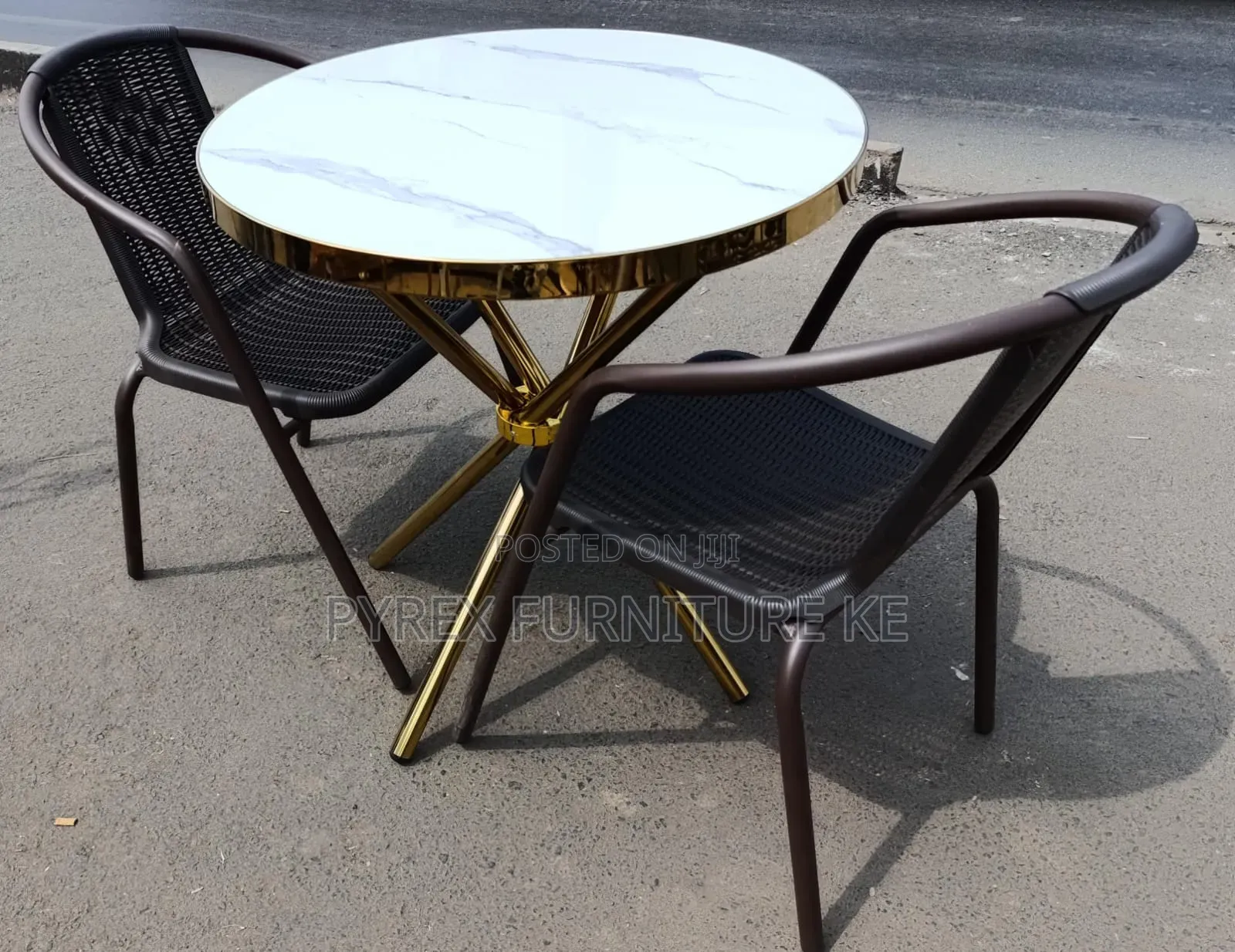Round Marble Top Cafe Table and Brown Woven Chairs