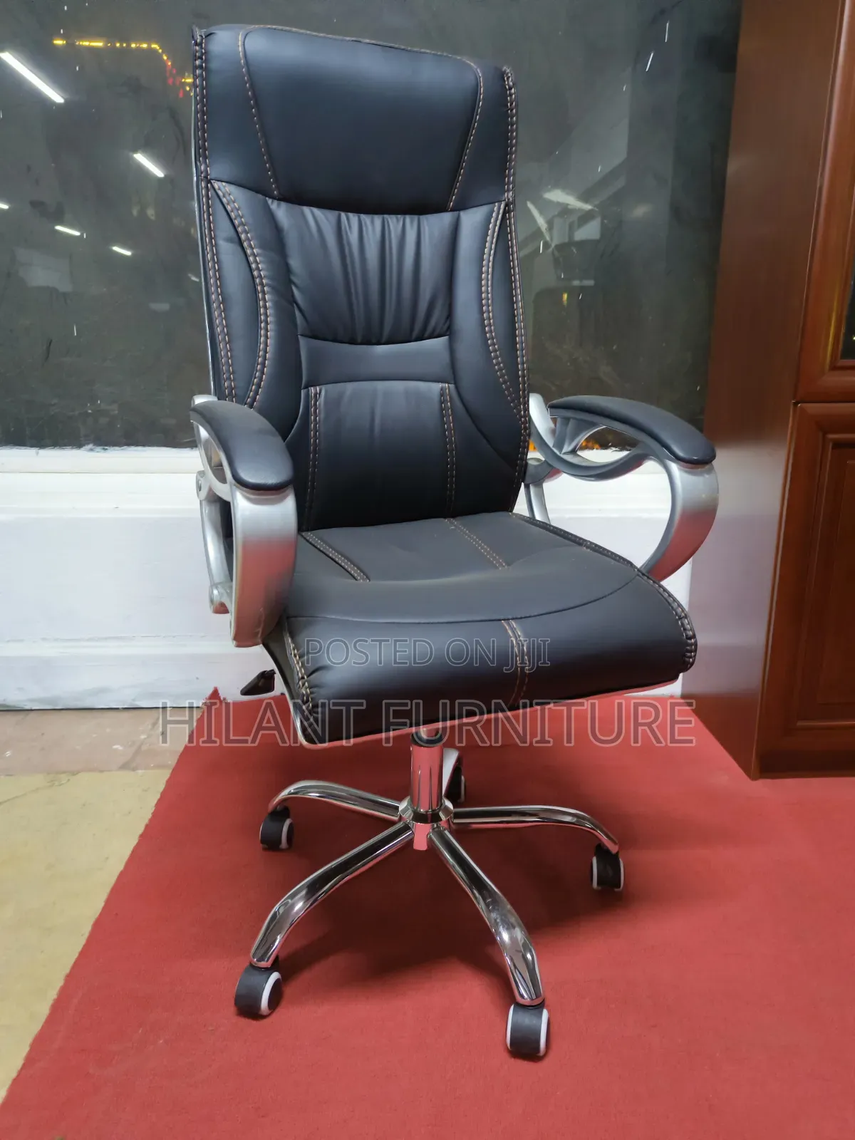 Executive High-Back Leather Office Chair With Chrome Armrests.