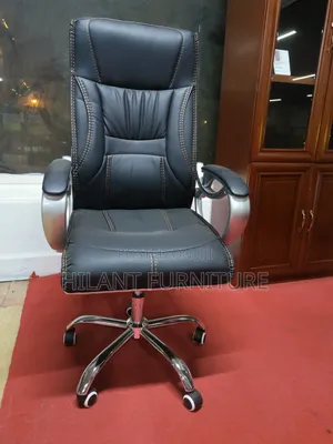 Executive High-Back Leather Office Chair With Chrome Armrests.