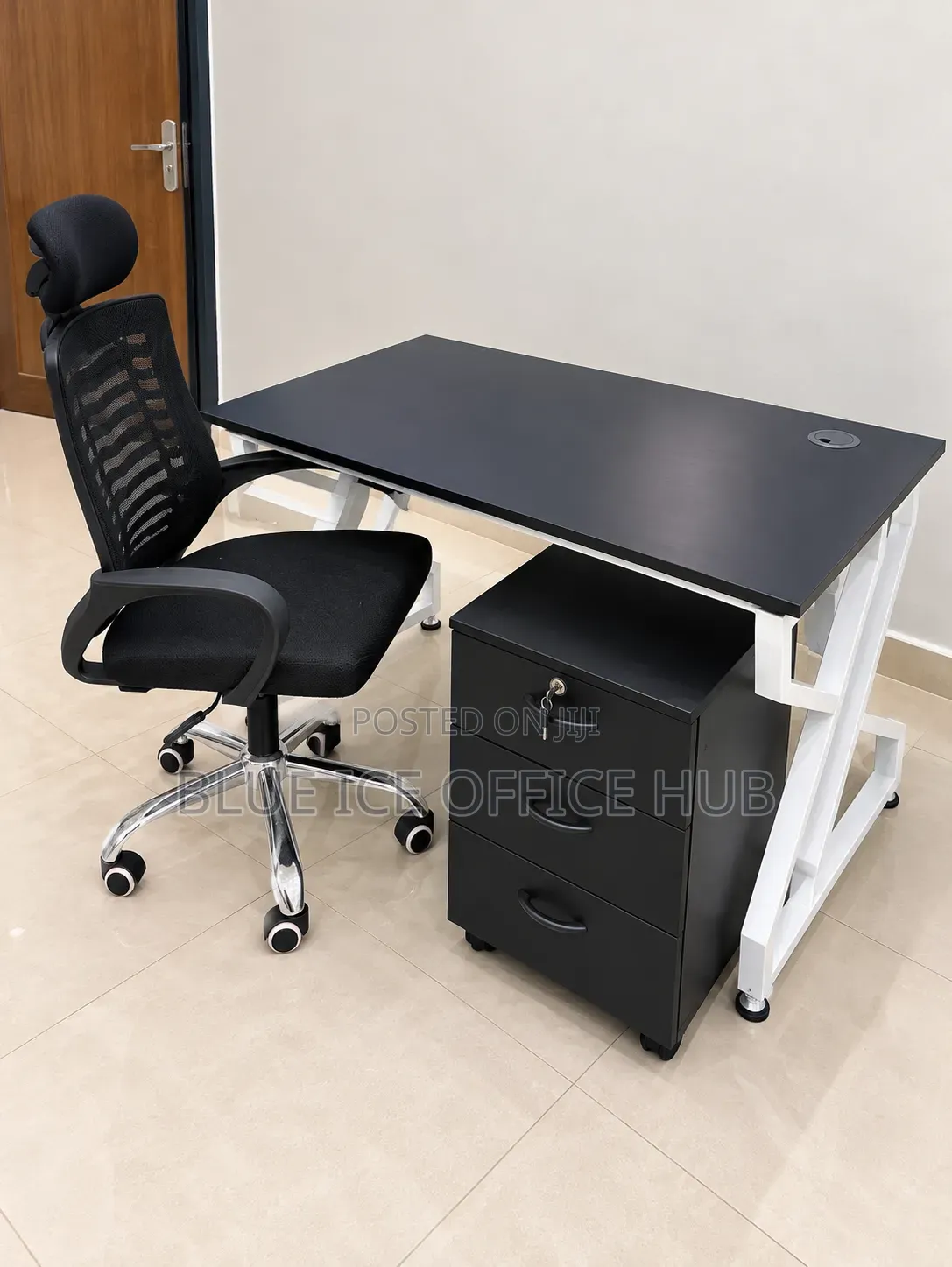 Black Office Desk With White Frame and Mesh Chair