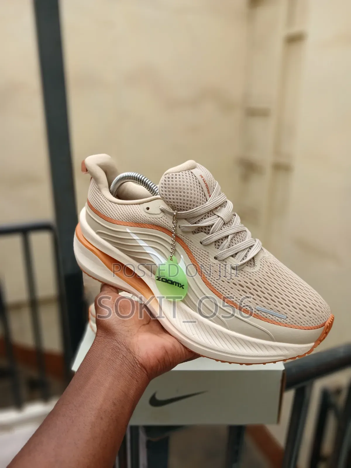 The Nike Vomero Plus in a Beige and Orange Colorway