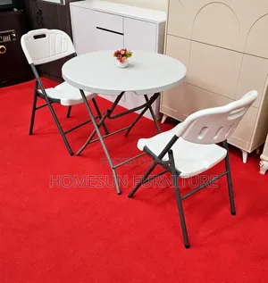 Round Folding Table With 2 White Chairs