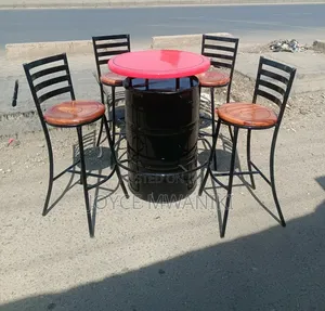 Bar Set of Wooden Round Mahogany Chairs and a Drum Table.