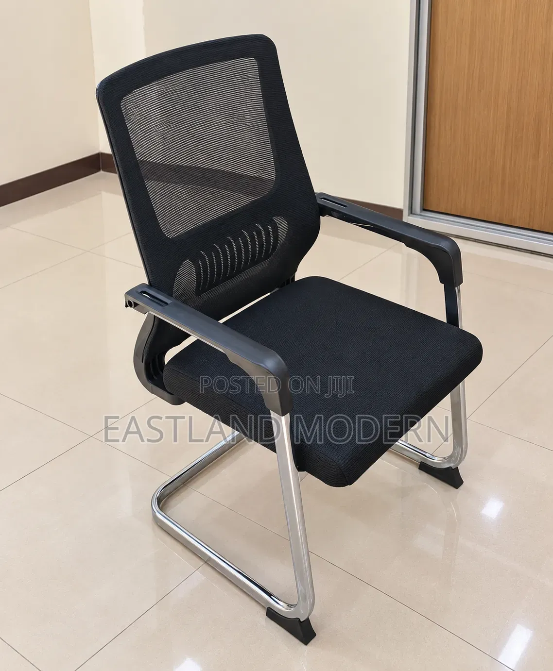 Black Mesh Visitor Chair With Padded Seat and Chrome Sled Base