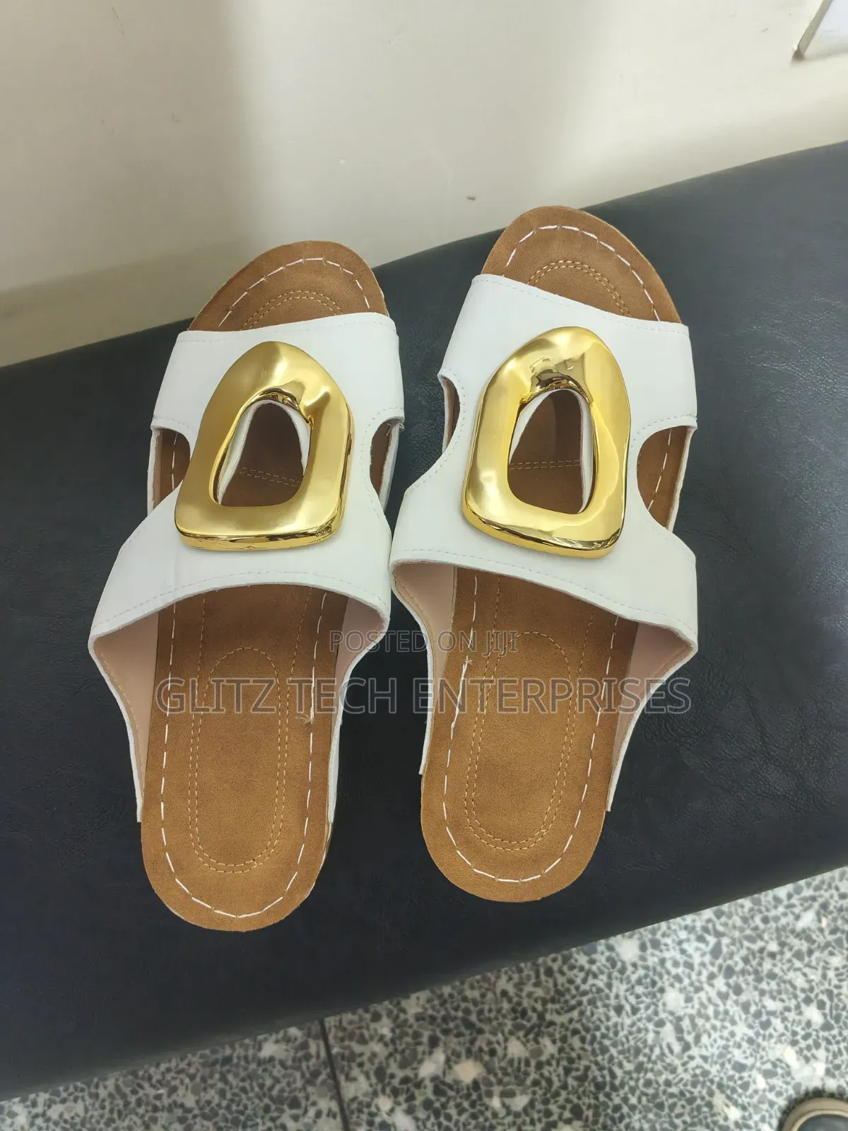 Ladies’ White Open-Toe Slide Sandals With Gold Buckle Accent