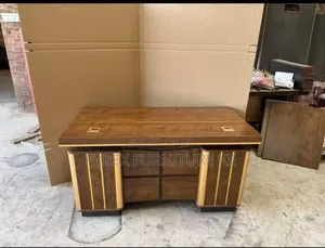 Brown Wood Manager Table With Gold Trim Accents and Cable Ports