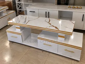 Modern White TV Stand With Gold Trim and Marble-Effect Finish