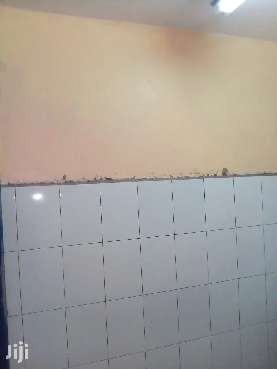 Tiling,Grouting and Cleaning of Tiles